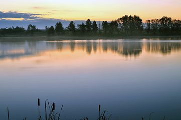 Image showing The morning landscape with sunrise over water in the fog