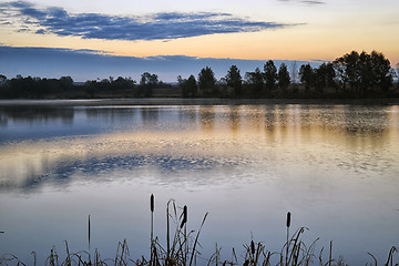 Image showing The morning landscape with sunrise over water in the fog