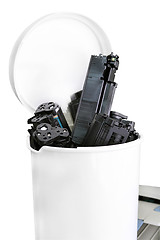 Image showing Cartridges from the printer in the trash can, standing on a prin