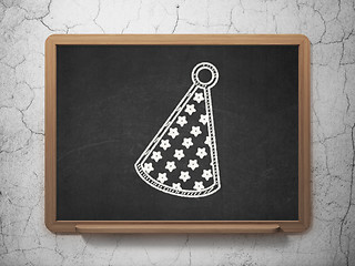 Image showing Holiday concept: Party Hat on chalkboard background