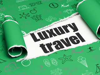 Image showing Vacation concept: black text Luxury Travel under the piece of  torn paper