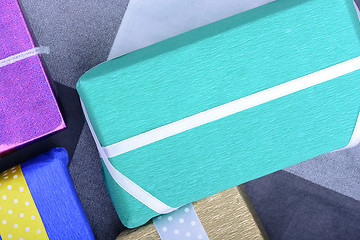 Image showing bright gifts with ribbons, holiday invitation card