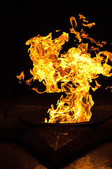 Image showing Red flames on black background.