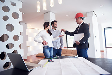 Image showing couple buying new home with real estate agent