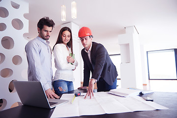 Image showing couple buying new home with real estate agent