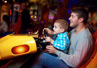 Image showing father and son playing game in playground