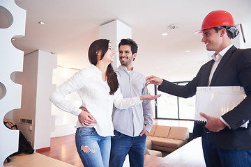 Image showing couple buying new home with real estate agent