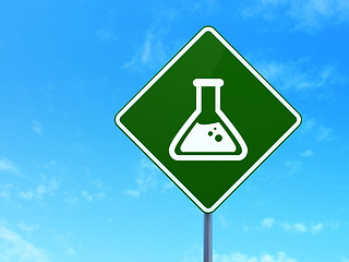 Image showing Science concept: Flask on road sign background