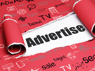 Image showing Advertising concept: black text Advertise under the piece of  torn paper