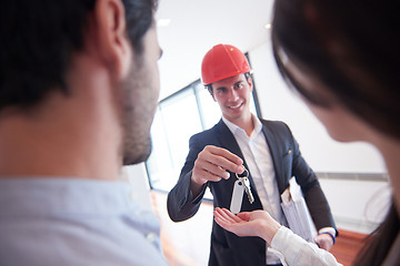 Image showing couple buying new home with real estate agent