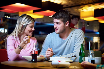 Image showing couple having lunch break in shopping mall