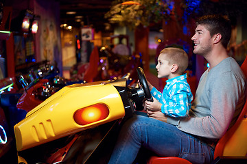 Image showing father and son playing game in playground