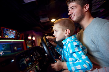 Image showing father and son playing game in playground