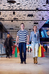 Image showing young couple with shipping bags