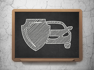 Image showing Insurance concept: Car And Shield on chalkboard background