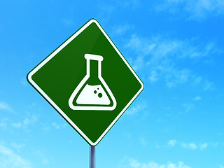 Image showing Science concept: Flask on road sign background