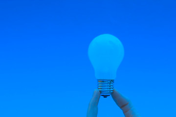 Image showing Background with lit lightbulb