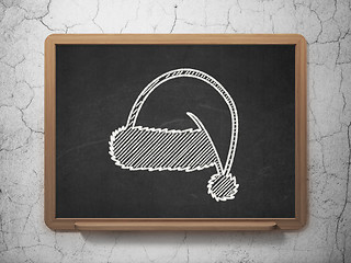 Image showing Entertainment, concept: Christmas Hat on chalkboard background