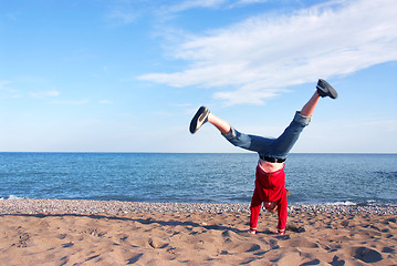 Image showing Girl doing cartwheel