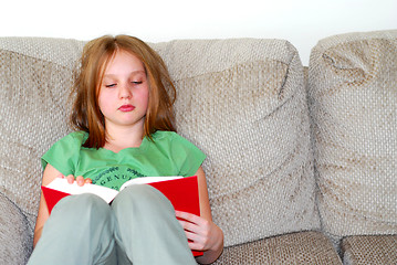 Image showing Young girl reading