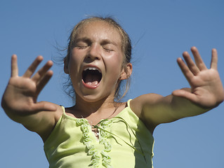 Image showing Girl shouting on the sky background