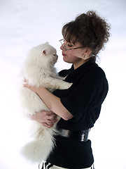 Image showing Young Lady in glasses holding cat