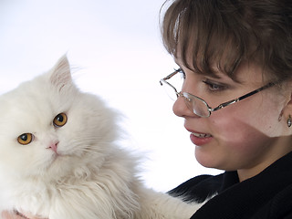 Image showing Young Lady in glasses holding cat