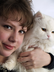 Image showing Young Lady holding white cat