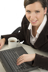 Image showing Young woman and computer