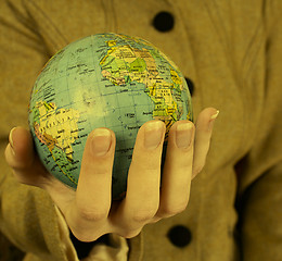 Image showing Globe in a girl's hands