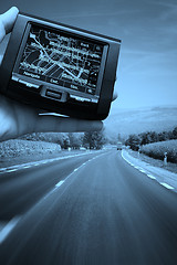 Image showing GPS Vehicle navigation system in a man hand.