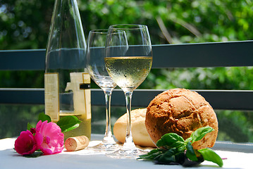 Image showing White wine with glasses outside