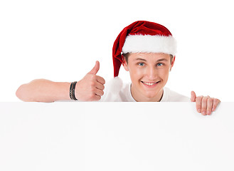 Image showing Young man in Santa hat