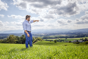 Image showing man outdoors pointing