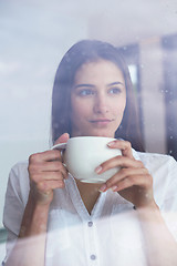 Image showing beautiful young woman drink first morning coffee