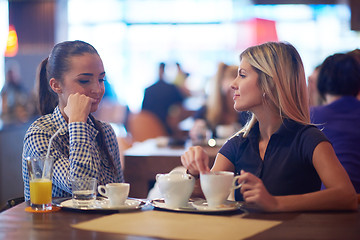 Image showing girls have cup of coffee in restaurant