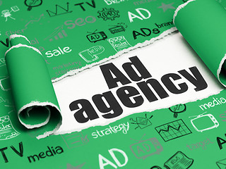 Image showing Advertising concept: black text Ad Agency under the piece of  torn paper