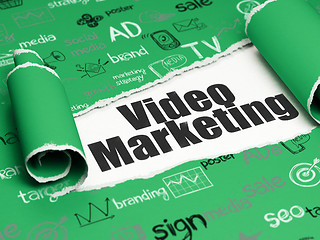 Image showing Advertising concept: black text Video Marketing under the piece of  torn paper