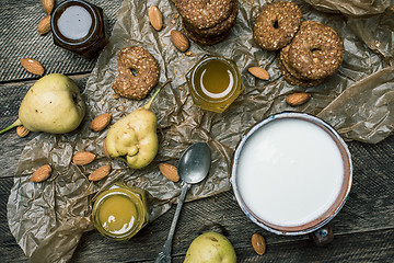 Image showing Cookies pears honey and yoghurt on wooden table