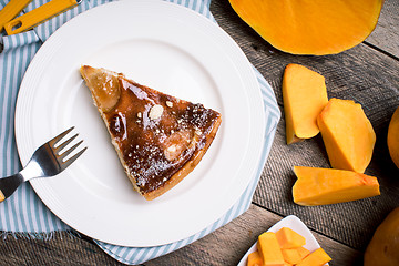 Image showing Breakfast piece of pie and Pumpkin slices in Rustic style