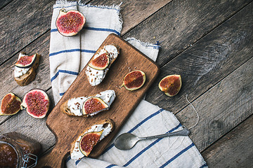 Image showing rustic style Bruschetta snacks with cheese and figs