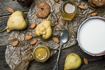 Image showing pastry pears honey and yoghurt on wooden table