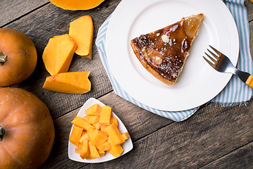 Image showing Pumpkin slices and piece of pie in Rustic style