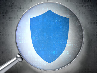 Image showing Protection concept: Shield with optical glass on digital background