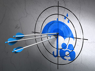 Image showing Safety concept: arrows in Family And Umbrella target on wall background