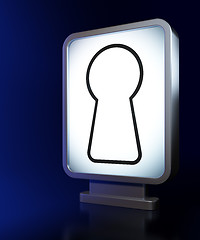 Image showing Security concept: Keyhole on billboard background