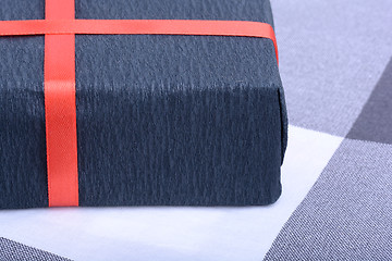 Image showing Black gift box with red ribbon