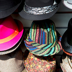 Image showing in london old red hat and black  the  fashion shop