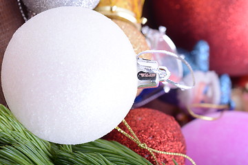 Image showing Closeup of beautiful Christmas baubles, Decorated christmas tree, holiday background, green tree eve branch close up with christmas balls 