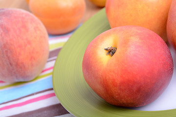 Image showing many different fruits for the health of the entire family, peach, mandarin, apple